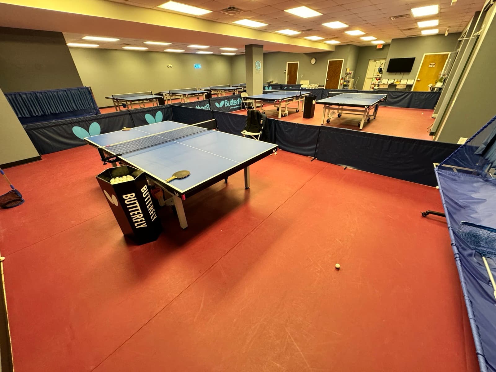 The CITTA training hall in Apex, NC, lined with tournament tables